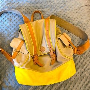 Tory Burch Boy Scout inspired backpack purse with side and inside compartments.